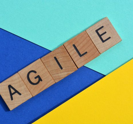 Agile, word in wooden alphabet letters isolated on colourful background