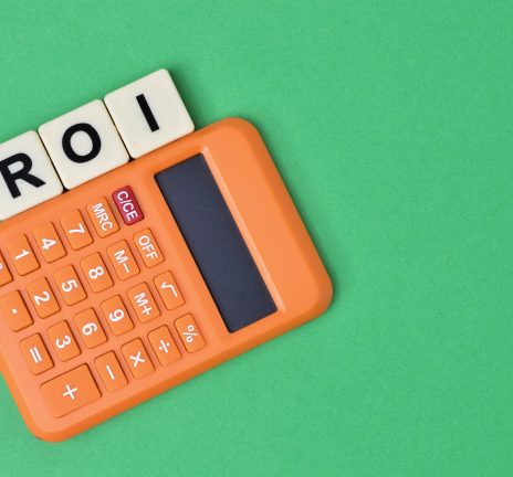 scrabble letters with text ROI stands for Return On Investment.
