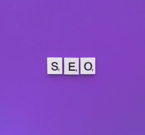 SEO scrabble letters word on a violet background.
